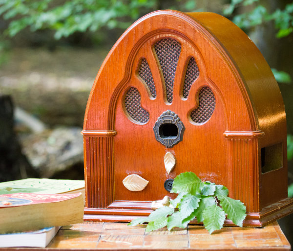 Photo of a 1940s radio that's been adapted to play a magical soundscape.